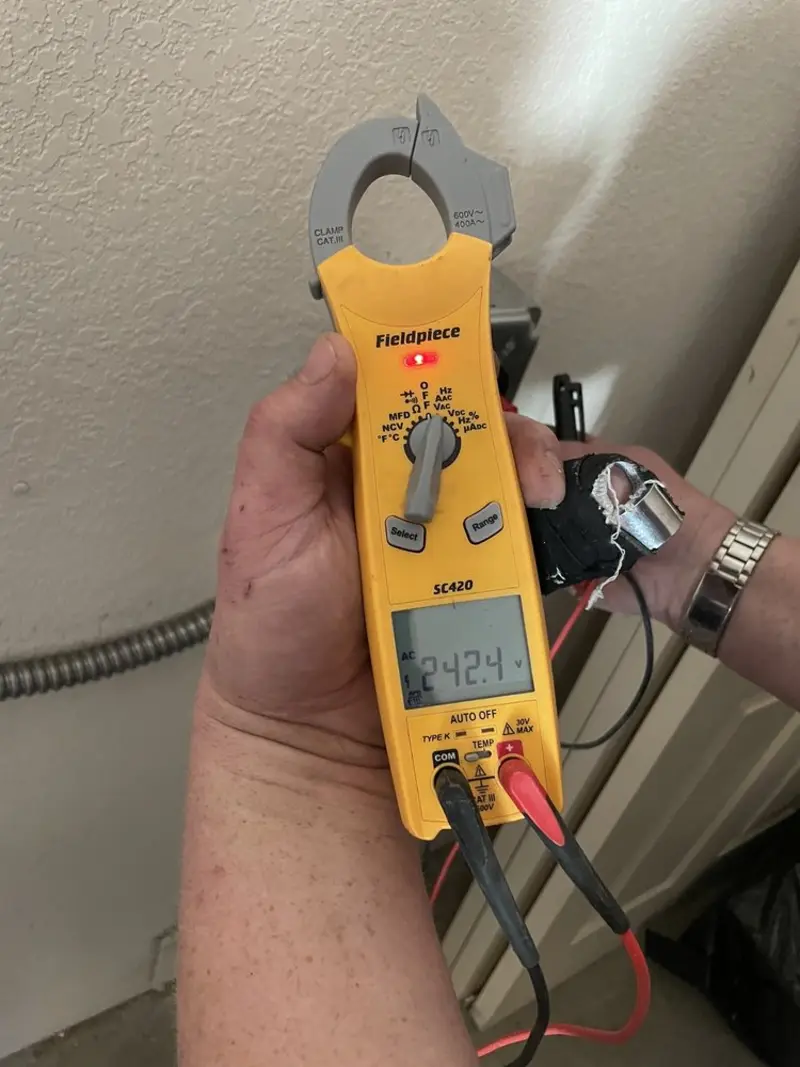 Voltage testing with clamp meter during Ceiling Fan Installation in Riverside